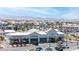 Street-level view of a commercial area with diverse dining and service options, complemented by mountain views in the background at 9527 Havasu Canyon Ave, Las Vegas, NV 89166
