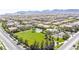 Aerial view of a park with a basketball court and pool showcasing community amenities, with beautiful mountain and neighborhood views at 9527 Havasu Canyon Ave, Las Vegas, NV 89166
