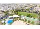 Aerial photo of a community park featuring a splash pad and basketball court, all complemented by lush landscaping and nearby homes at 9527 Havasu Canyon Ave, Las Vegas, NV 89166