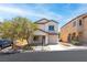 Well-maintained two-story home with a neutral color scheme, attached garage, and desert-friendly landscaping at 9527 Havasu Canyon Ave, Las Vegas, NV 89166