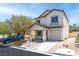 Charming two-story home featuring stucco siding, a covered porch, and a well-maintained front yard at 9527 Havasu Canyon Ave, Las Vegas, NV 89166