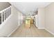 Spacious and bright view of stairs leading into a kitchen featuring wooden cabinets and granite island at 9527 Havasu Canyon Ave, Las Vegas, NV 89166