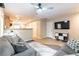 Open-concept living space featuring neutral paint, sofa, and a view into the kitchen at 9527 Havasu Canyon Ave, Las Vegas, NV 89166