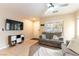 Comfortable living area featuring neutral paint, sofas, entertainment center, and a window to the outside at 9527 Havasu Canyon Ave, Las Vegas, NV 89166