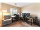 This home office features dual workstations with lots of natural light and room for an armchair at 9527 Havasu Canyon Ave, Las Vegas, NV 89166