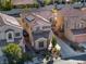 Aerial view showcasing the home's tile roof, solar panels, landscaping, and neighborhood at 9533 Solitude Canyon Ave, Las Vegas, NV 89149