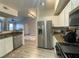 Well-lit kitchen showcasing stainless steel appliances and functional layout at 9975 Peace Way # 2015, Las Vegas, NV 89147