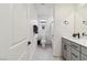 This bright bathroom with grey cabinets features clean lines and a modern aesthetic at 10190 Natural Anchor St, Las Vegas, NV 89166