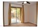 Bedroom featuring carpet flooring, tan curtains, and a sliding glass door leading to the backyard at 10239 Premia Pl, Las Vegas, NV 89135