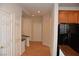 Hallway with tile flooring and three white doors leading to other rooms in the home at 10239 Premia Pl, Las Vegas, NV 89135