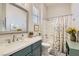 Bathroom featuring modern vanity, bathtub/shower combo, and bright lighting at 1049 Via Saint Lucia Pl, Henderson, NV 89011