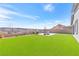 A well-kept backyard featuring green grass and a patio set at 116 Juliette Pointe Ln, Henderson, NV 89011