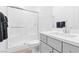 Bathroom with a glass-enclosed shower, modern vanity, sleek sink, and neutral color scheme at 116 Juliette Pointe Ln, Henderson, NV 89011