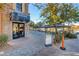 Exterior view of a grocery store with outdoor seating, landscaping and a view of the nearby lake at 116 Juliette Pointe Ln, Henderson, NV 89011