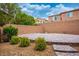 Large backyard patio space with desert landscaping and privacy wall at 12240 Old Muirfield St, Las Vegas, NV 89141