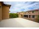Spacious upper balcony with painted concrete floor, black metal railing, and desert views at 12240 Old Muirfield St, Las Vegas, NV 89141