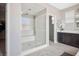 Spacious bathroom featuring a glass enclosed walk-in shower, vanity and recessed lighting at 12240 Old Muirfield St, Las Vegas, NV 89141