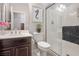 Bathroom with a glass door shower, vanity with sink, and neutral-colored walls and floors at 12240 Old Muirfield St, Las Vegas, NV 89141