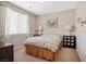 Bedroom with neutral walls, neutral carpeting, white window coverings, and furnished with art at 12240 Old Muirfield St, Las Vegas, NV 89141