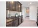 Upstairs hallway with cabinetry for linen storage and views to the adjacent bedrooms at 12240 Old Muirfield St, Las Vegas, NV 89141