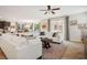 Open concept design featuring a cozy living room with a large couch and access to backyard at 12240 Old Muirfield St, Las Vegas, NV 89141