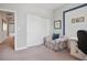 Inviting room showcasing a cozy floral armchair, a convenient storage closet, and a functional desk setup at 12240 Old Muirfield St, Las Vegas, NV 89141