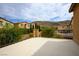 Outdoor patio with neutral-colored paving and a metal railing with neighborhood views at 12240 Old Muirfield St, Las Vegas, NV 89141