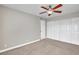 Bedroom featuring neutral carpet, ceiling fan, and large closet at 1344 Lorilyn Ave # 3, Las Vegas, NV 89119