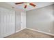 Bedroom with neutral carpet, ceiling fan and closet at 1344 Lorilyn Ave # 3, Las Vegas, NV 89119