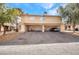 Rear view of home showing driveways, and ample parking space at 1344 Lorilyn Ave # 3, Las Vegas, NV 89119