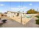 Backyard view featuring a beautiful swimming pool and the exterior of the house at 1516 Saylor Way, Las Vegas, NV 89108