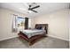 Bedroom with a bed, ceiling fan, and bright window at 1516 Saylor Way, Las Vegas, NV 89108