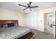 Bedroom with a bed, ceiling fan, closet, and neutral color palette at 1516 Saylor Way, Las Vegas, NV 89108