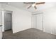 Standard empty bedroom with carpeted floors, closet, and ceiling fan at 1904 Monte Alban Dr, North Las Vegas, NV 89031