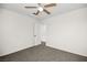 Standard, neutral bedroom with carpeted floors, closet, ceiling fan and adjoining room at 1904 Monte Alban Dr, North Las Vegas, NV 89031