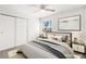 Well-lit bedroom featuring a spacious closet, plush carpet, and large window at 1904 Monte Alban Dr, North Las Vegas, NV 89031