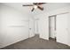 Bright bedroom with carpeted floors, closet, and a ceiling fan for added comfort at 1904 Monte Alban Dr, North Las Vegas, NV 89031