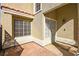 Private courtyard entrance showcasing a decorative security door and ample natural light at 1904 Monte Alban Dr, North Las Vegas, NV 89031