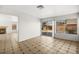 Spacious living room featuring tile flooring, a fireplace, and sliding glass doors at 1904 Monte Alban Dr, North Las Vegas, NV 89031