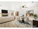 Bright living room with a fireplace, ceiling fan and a neutral color scheme that creates a cozy atmosphere at 1904 Monte Alban Dr, North Las Vegas, NV 89031