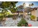 Relaxing backyard patio with comfortable seating, a covered pergola, and stone pavers at 1905 Calle De Espana, Las Vegas, NV 89102