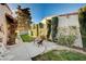 Backyard patio featuring a stone path and decorative bench seating at 1905 Calle De Espana, Las Vegas, NV 89102