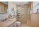 Well-lit bathroom with walk-in shower featuring accessible grab bar and built-in bench seating at 1905 Calle De Espana, Las Vegas, NV 89102