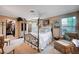 Traditional bedroom features a decorative bed, a cozy chair, and a well-organized walk-in closet at 1905 Calle De Espana, Las Vegas, NV 89102