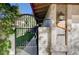 Close-up of a gated courtyard entrance with a brick pathway and exterior lighting at 1905 Calle De Espana, Las Vegas, NV 89102