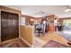 Dining area with hardwood floors, stylish furniture and a large wooden entry door at 1905 Calle De Espana, Las Vegas, NV 89102