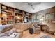 Living room with built-in shelving, neutral walls, and seating at 1905 Calle De Espana, Las Vegas, NV 89102