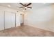 This bedroom features carpet flooring, a fan, and a closet at 212 Huntly Rd, Las Vegas, NV 89145