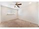 This bedroom features neutral walls and a ceiling fan at 212 Huntly Rd, Las Vegas, NV 89145