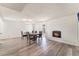 Bright dining room featuring a fireplace, wood floors, and sliding glass door at 212 Huntly Rd, Las Vegas, NV 89145